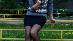 Woman ice cream Jumper sitting fences outdoors long hair 