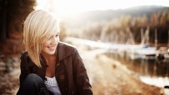 Woman jackets blondes sunlight smiling straight hair blurred 