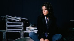 Woman jeans faces sitting jackets long hair brown eyes 