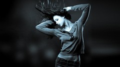 Woman jeans monochrome looking down blurred arms raised exposed 