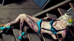 Woman ladder legs blondes tattoos lingerie lying down flower in 