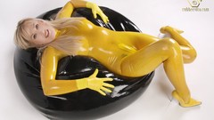 Woman latex rubber blondes strategic covering high heels 