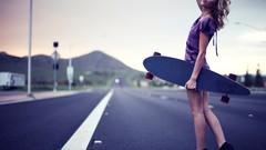 Woman legs longboard