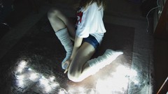 Woman lights jeans Headless sitting knee socks white socks body 