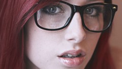 Woman makeup close-up glasses faces long hair blue eyes 