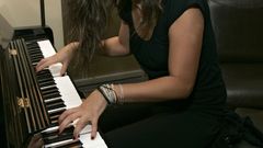 Woman mila kunis piano
