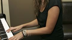 Woman mila kunis piano