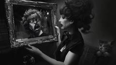 Woman mirrors tears grayscale