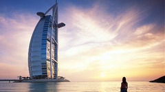 Woman ocean buildings