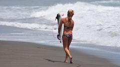 Woman ocean waves surfing