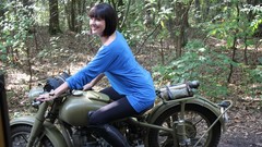 Woman outdoors smiling boots models blue dress motorbikes 