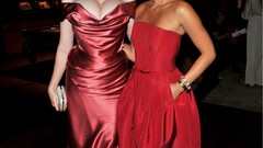 Woman red dress Actress earrings bracelets smiling green eyes 