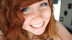 Woman redheads freckles smiling