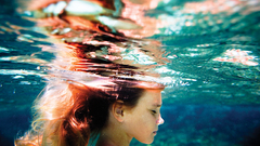 Woman redheads underwater