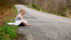 Woman roads little girl