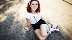 Woman roads sitting legs outdoors models redheads roller skates
