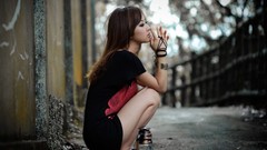 Woman sitting asians brunettes crouched