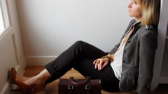 Woman sitting floor jackets handbag blondes models high heels 