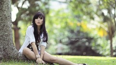 Woman sitting outdoors bangs models black hair white shirts 