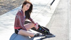 Woman sitting outdoors brown eyes brunettes skateboards Aiden 