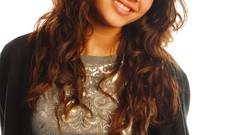 Woman smiling naomi scott brunettes dark eyes curly hair