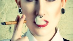 Woman smoke cigars aggressive piercings