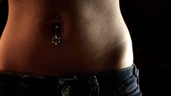 Woman stomach piercings