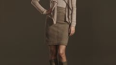 Woman summer glau brown background hands on hips The Cape 