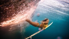 Woman surfing Underwater World