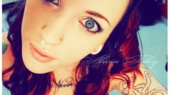 Woman tattoos blue eyes piercings Alicia Foley