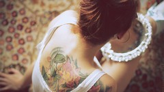 Woman tattoos mirrors brownies hair bun