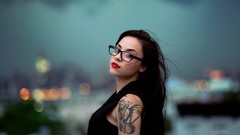 Woman tattoos models nose ring