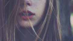 Woman teeth mouth braces hair in face