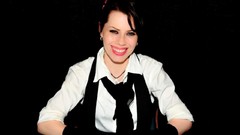 Woman tie black background Celebrity gloves Actress smiling 