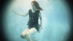 Woman underwater redheads pale skin Lass-model Julie Kennedy