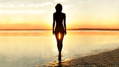 Woman water sunset sand
