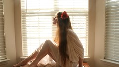 Woman white dress models window blinds natural lighting