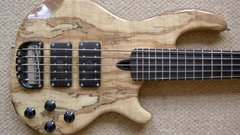 Wood bass guitars