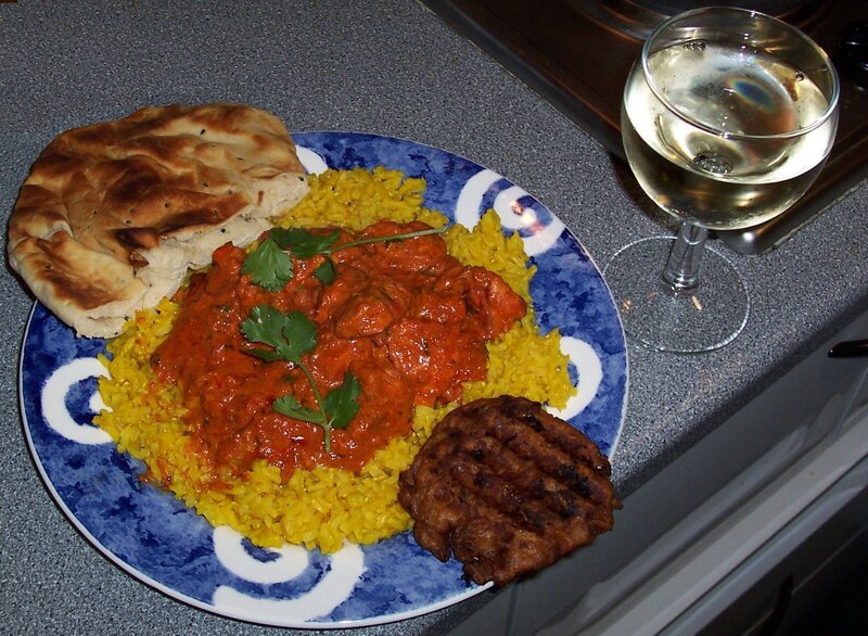 Indian meal with naan and wine