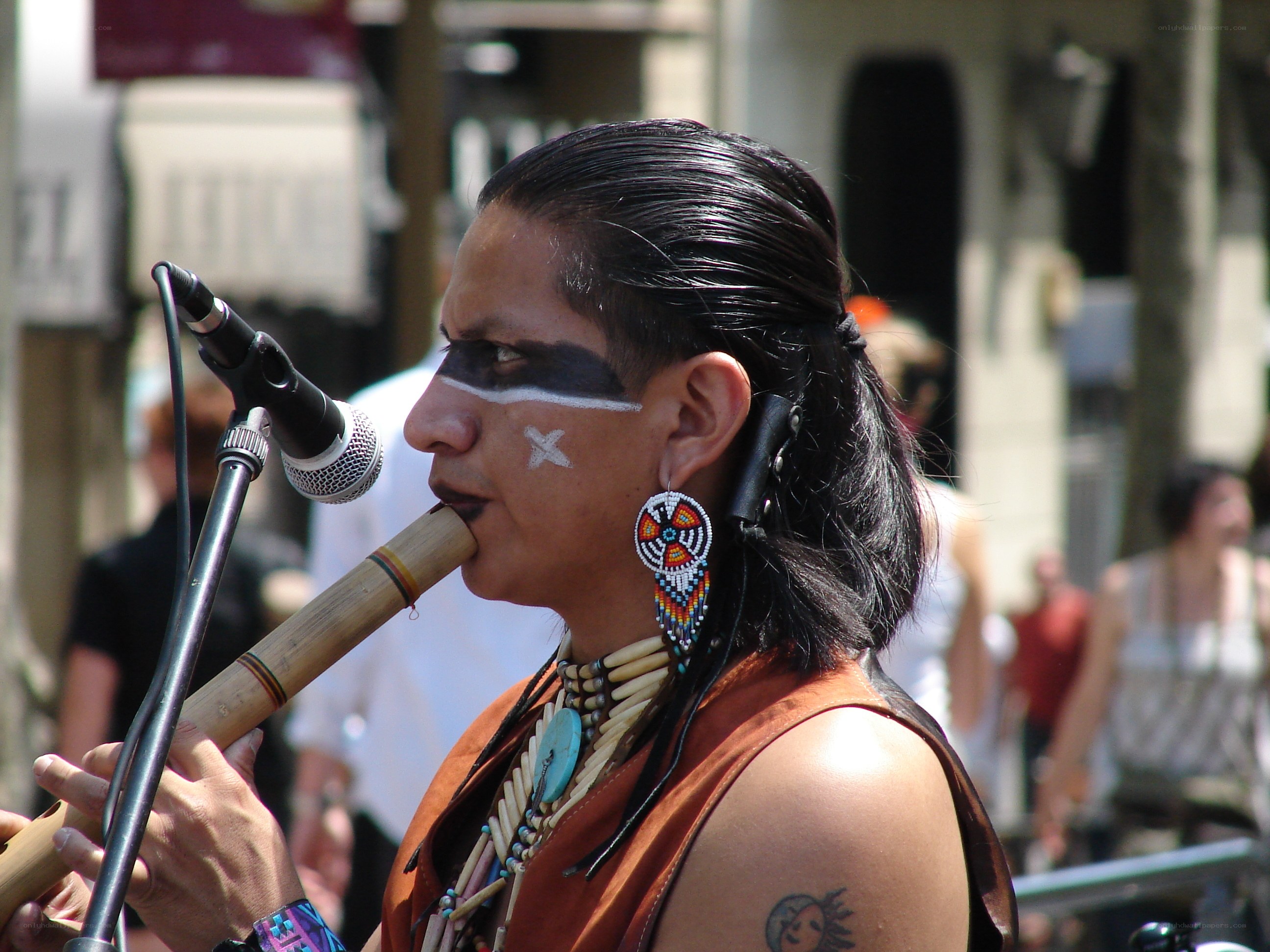 Indigenous musician playing flute