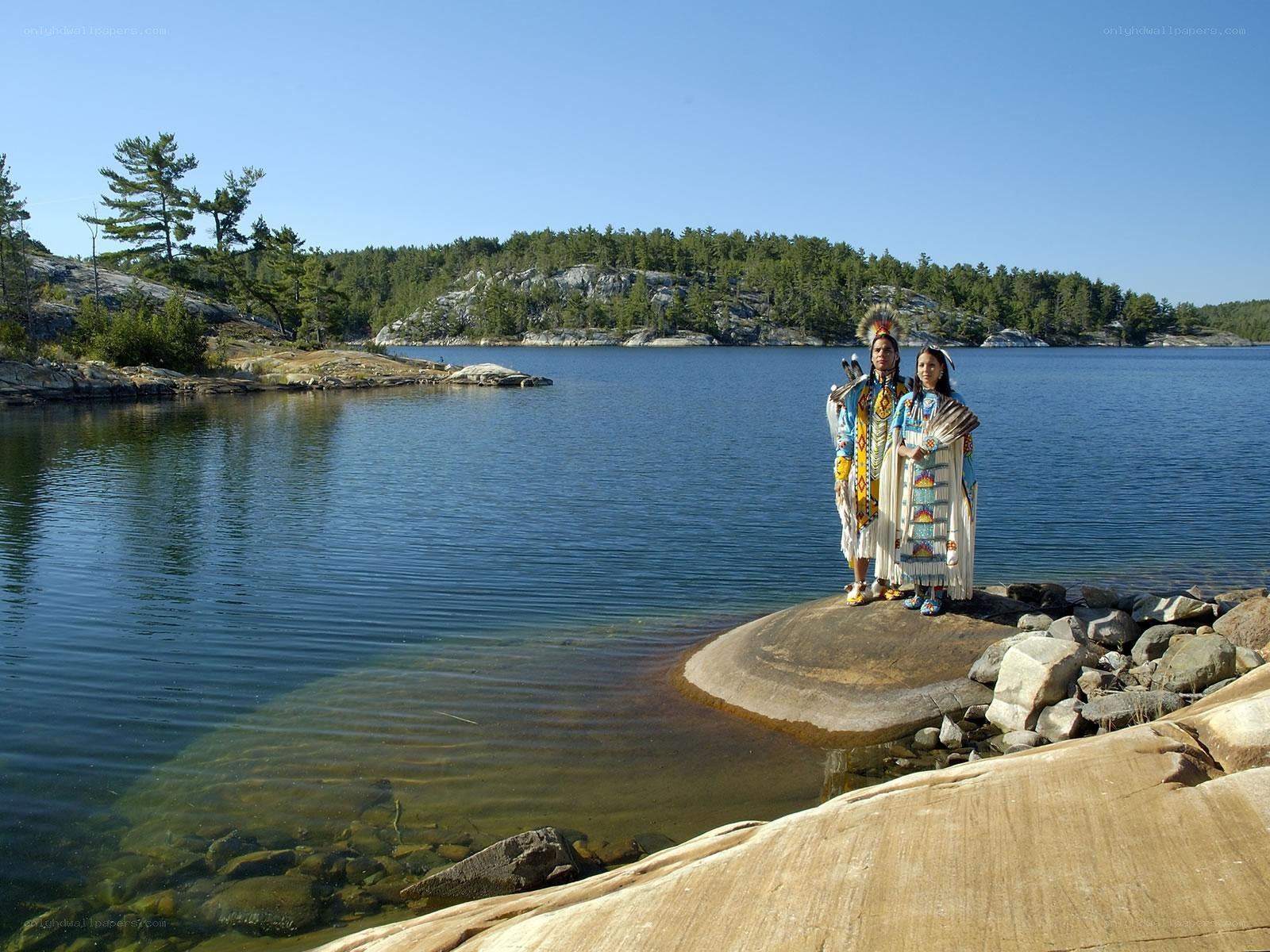 Indigenous people by a lake
