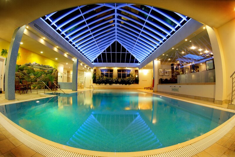 indoor pool with blue lighting