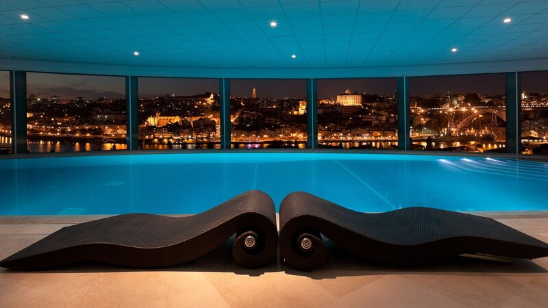 Indoor Pool with City View — Blue, Serene