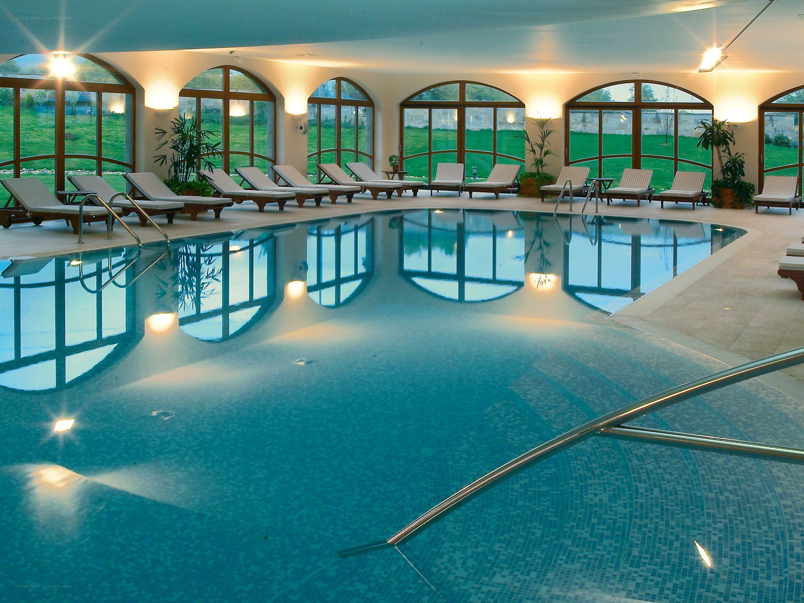 Indoor pool with lounge chairs