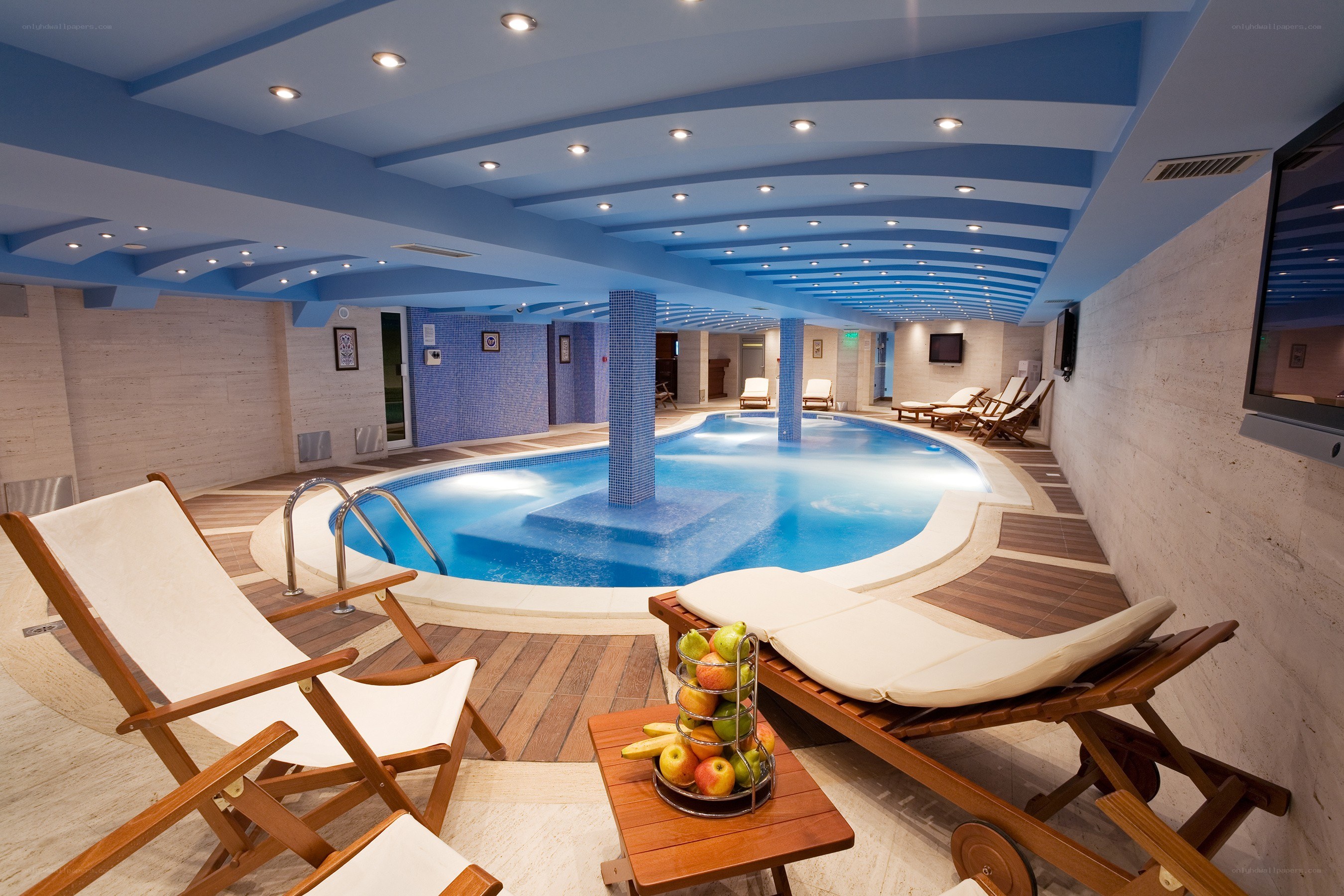 Indoor pool with lounge chairs