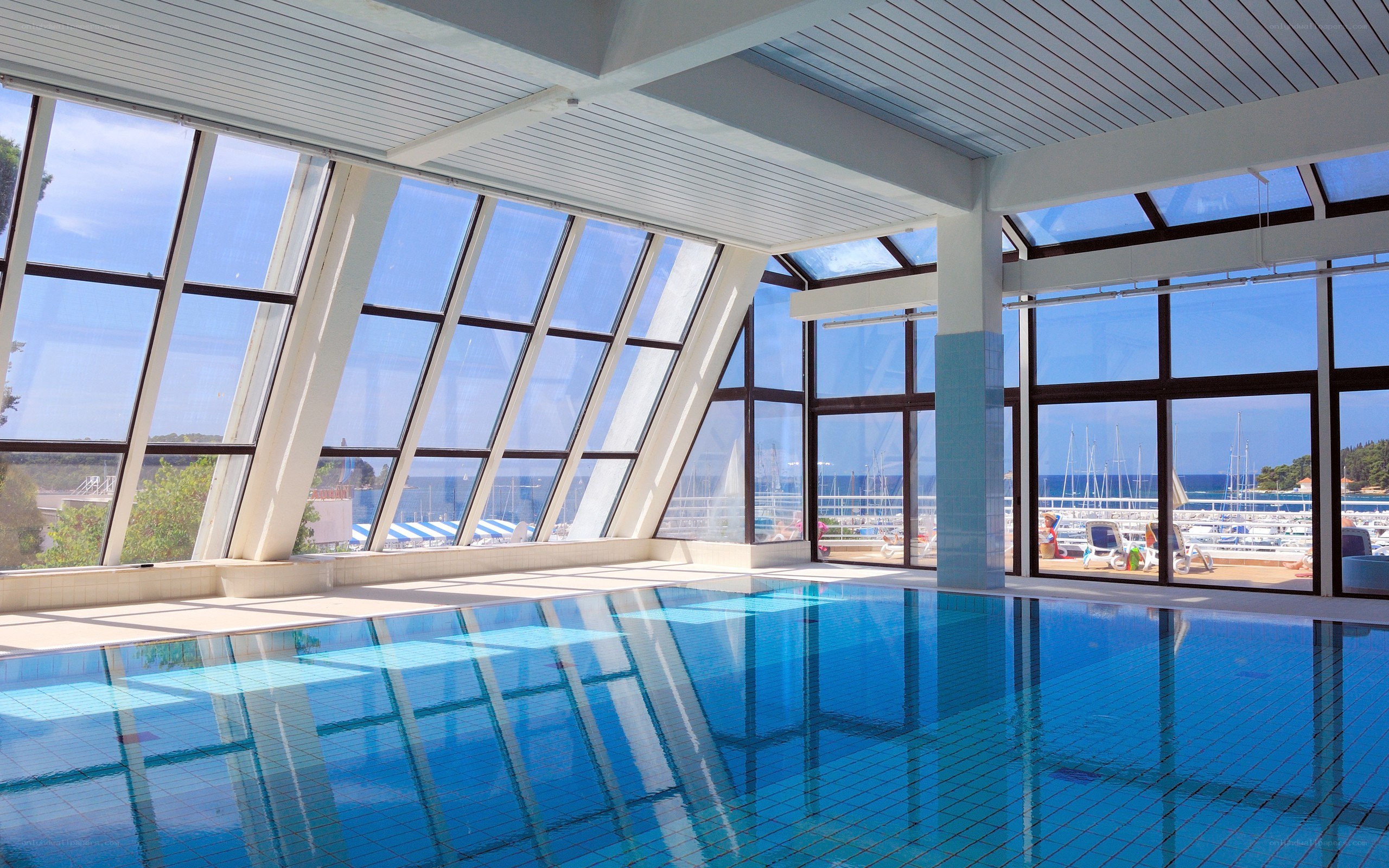 Indoor pool with marina view