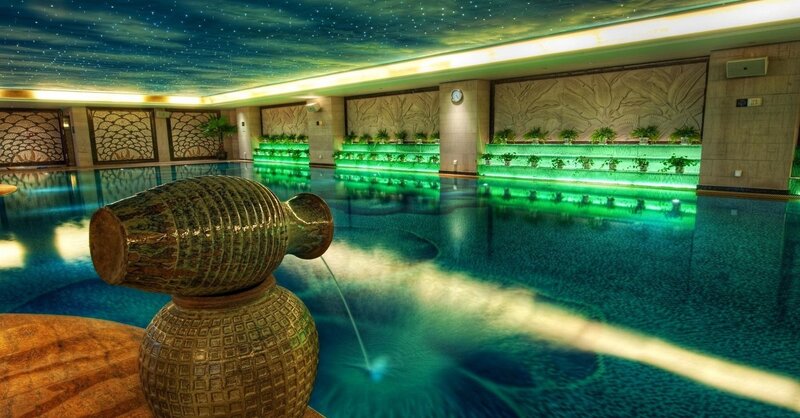 indoor pool with starry ceiling