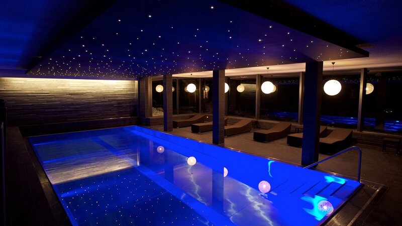 indoor pool with starry ceiling