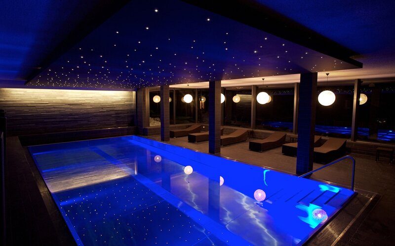 indoor pool with starry ceiling