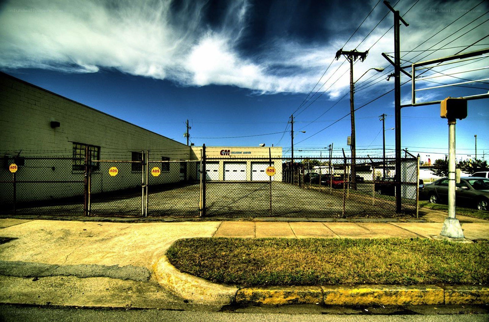 Industrial building with chain-link fence